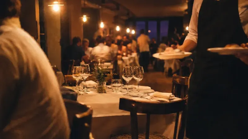 A restaurant dining room during evening service