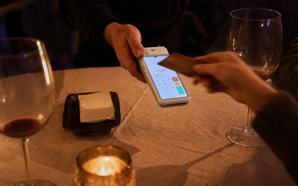 Taking a card payment at a restaurant table